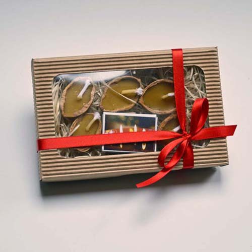 vanocni plovouci reklamni svicky z orechovych skorapek vánocni balicek pro zakazniky reklamní zápalky